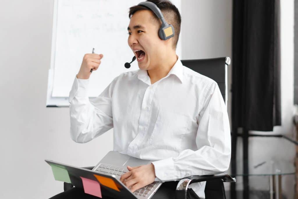  A man celebrating a winning trade - TradeZella